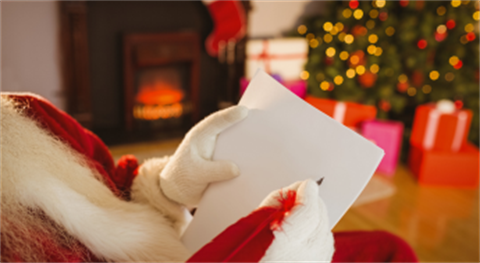 Santa writing on paper
