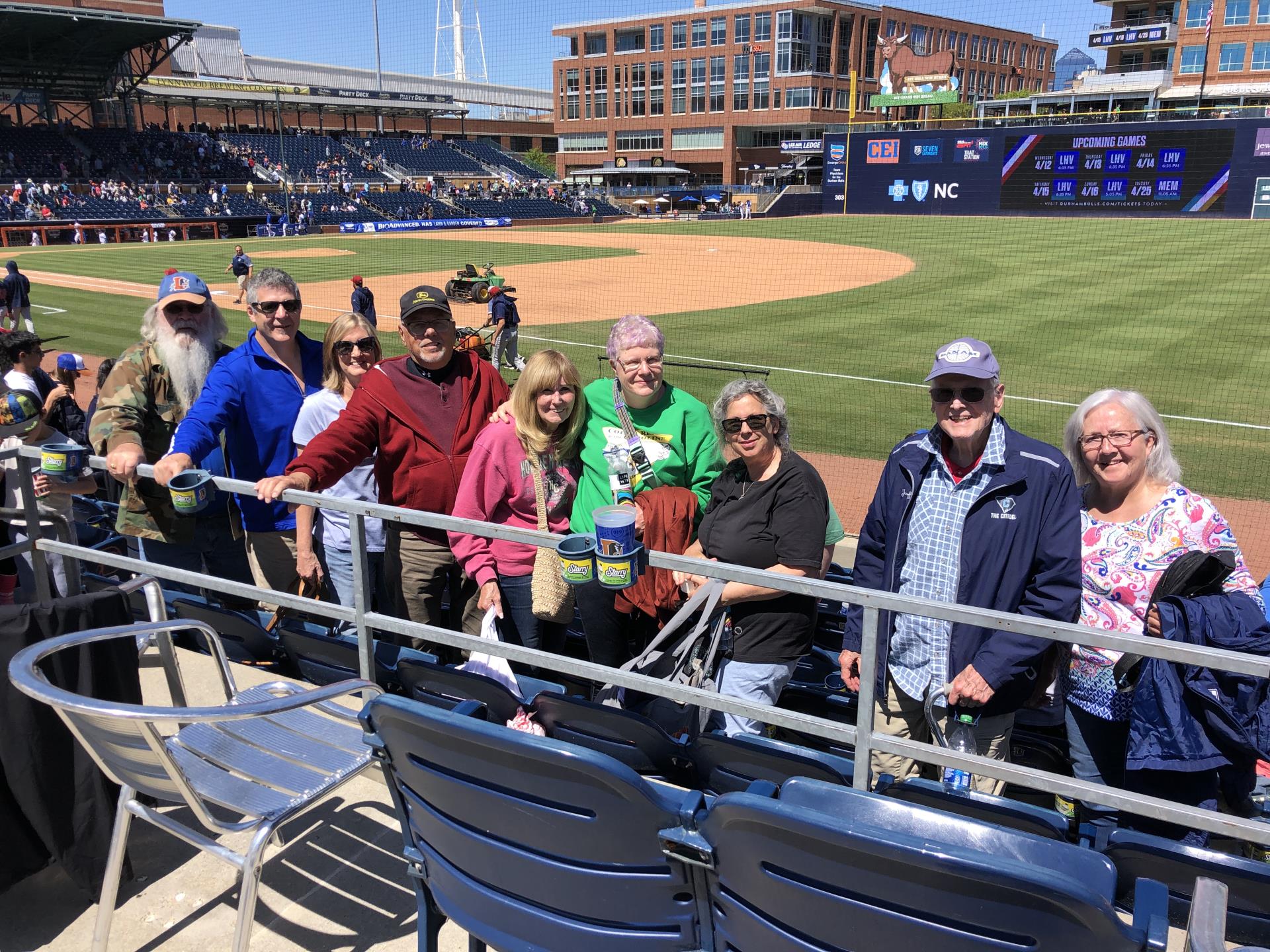 seniors-pose-for-a-group-photo-at-a-Durham-Bulls-baseball-game.jpeg