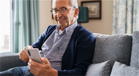 senior using an iphone